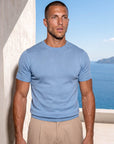 Man wearing light blue Morengar knit t-shirt outdoors