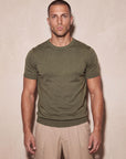 Man in olive green knit t-shirt and beige shorts, Morengar menswear