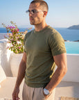 Man in olive green knit t-shirt by the sea, Morengar summer style