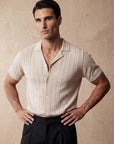 Man in beige vertical texture knit shirt with hand on hip, Morengar menswear