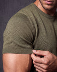 Close-up of olive green knit t-shirt fabric, Morengar soft-touch stretch