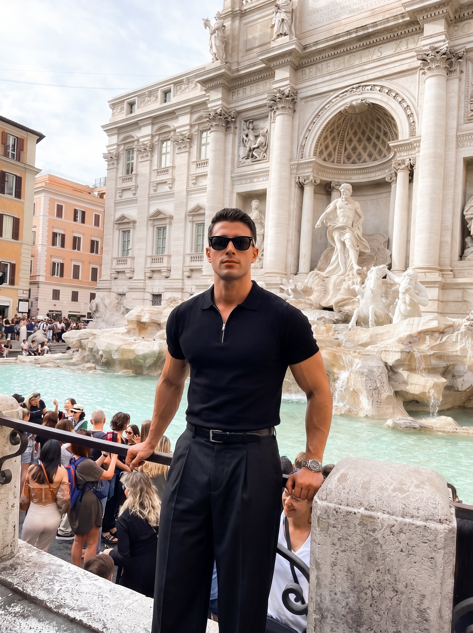 Man in black half-zip knit polo, full outfit outdoors