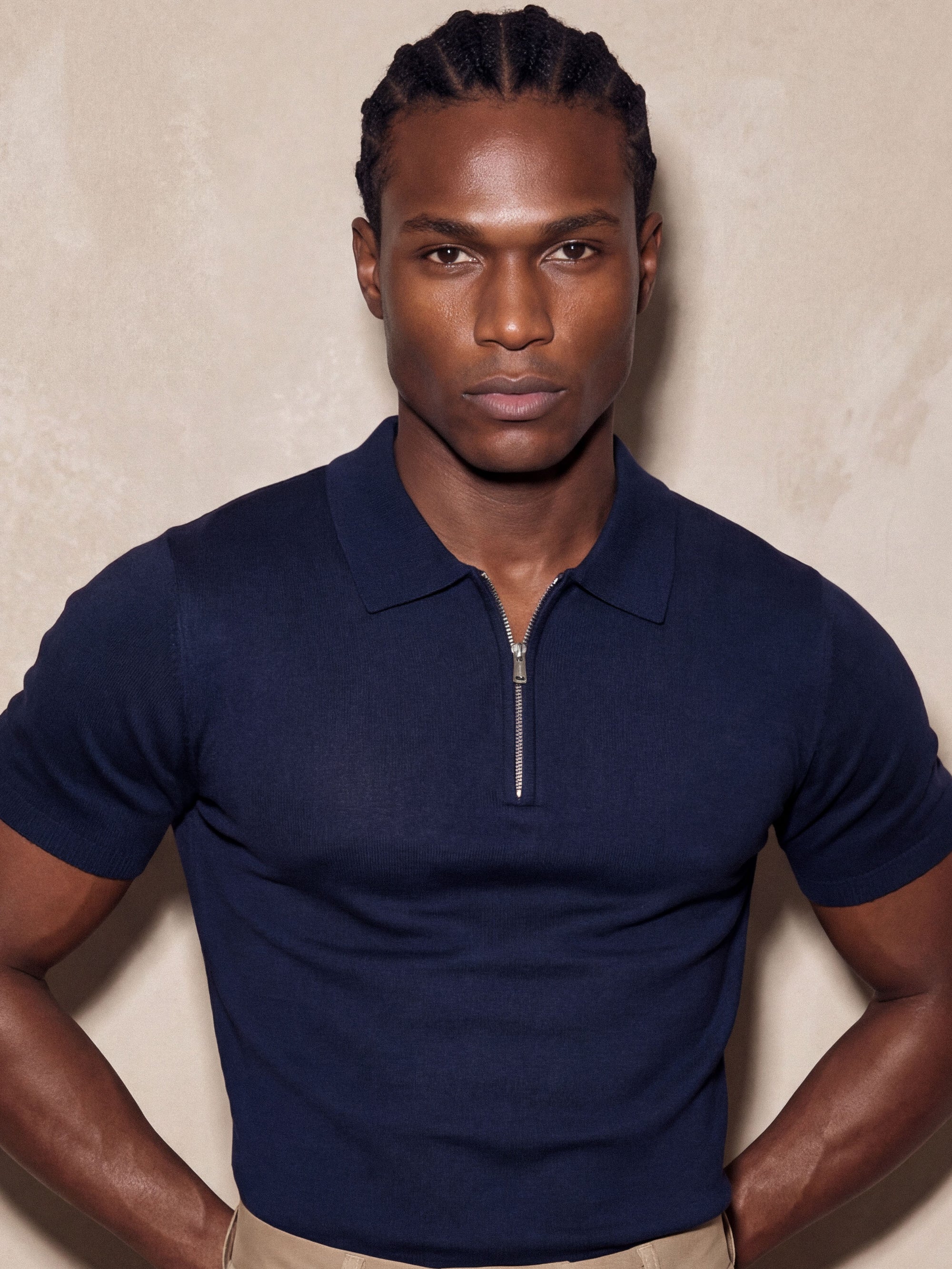 Man in navy knit polo with hand on hip, Morengar menswear