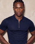 Man in navy knit polo with hand on hip, Morengar menswear